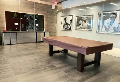 a ping pong table in a room with pictures at Amazing Studio Located in Upscale-Prime Location. Walking Distance to Restaurant in Miami
