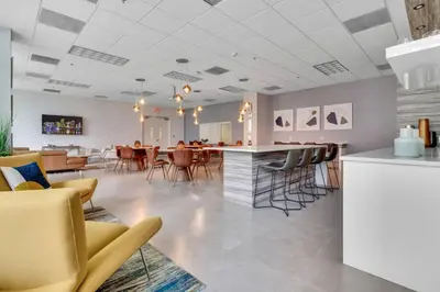 a lobby with chairs and a bar in a restaurant at 3BR Penthouse with European Flair n Amazing Views in Miami