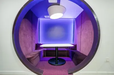 a round mirror with a table in a purple room at Explore Miami's Heat - Cozy Studio POOL & GYM in Miami