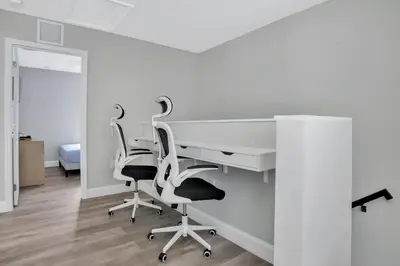 an office with a white desk and two chairs at Sistrunk Shades Villa #4 - Townhome Downtown Fort Lauderdale Near Cruise Port & FLL in Fort Lauderdale