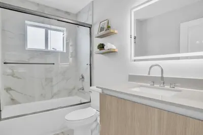 a bathroom with a toilet and a sink and a shower at Sistrunk Shades Villa #4 - Townhome Downtown Fort Lauderdale Near Cruise Port & FLL in Fort Lauderdale