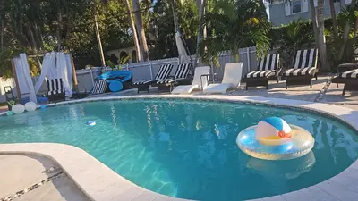 a swimming pool with a beach ball and aogie board at Pool Paradise Half mile to Beach w Massive Yard! in Hollywood