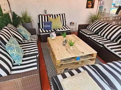 a living room with couches and a wooden coffee table at Pool Paradise Half mile to Beach w Massive Yard! in Hollywood