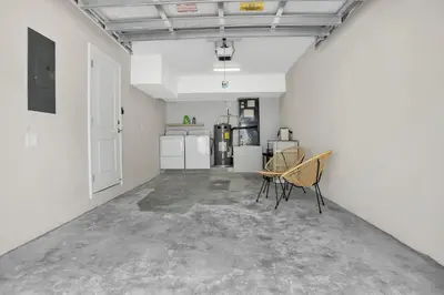 an empty room with chairs and appliances in a building at Sistrunk Shades Entire Compound 5 Homes 50 Guests in Fort Lauderdale