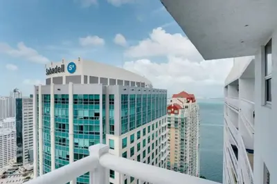 a view of the ocean from a balcony of a building at Chic Penthouse: 3BR x Pool x Gym x 2 Parking Spots in Miami