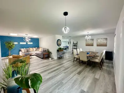 a living room with a couch and a table at Oasis in Plantation South Florida in Plantation