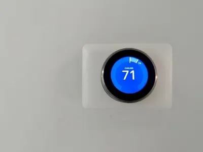 a blue clock on a white wall at Oasis in Plantation South Florida in Plantation