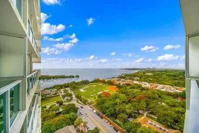 an apartment view from a building with the ocean in the background at 1-BD Condo in Coconut Grove - Water Views in Miami