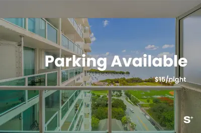 a view from the balcony of a building with the words parking available at 1-BD Condo in Coconut Grove - Water Views in Miami