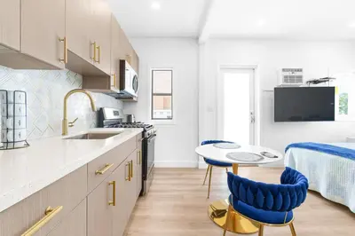 a kitchen with a table and chairs and a bed at 316 Seascape Unit 2 in Hollywood