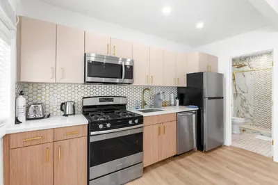 a kitchen with a stove and a refrigerator at 316 Footloose #3 in Hollywood