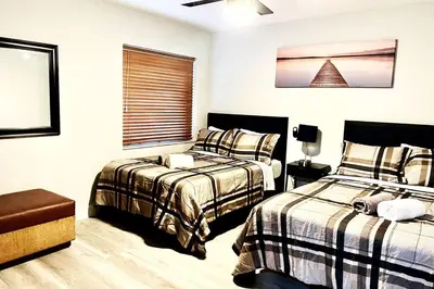 a bedroom with two beds and a window at SUPER CLOSE Beach, Airport, port, Downtown, Wynwood in Miami