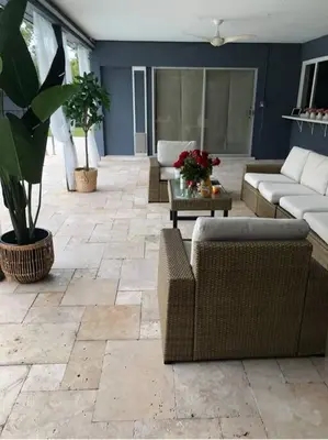 a living room with couches and a table with plants at Spacious 4 Bedroom 3 Bathroom House with Heated Pool and Outdoor Shower close to FFL Airport and Cruise Port in Plantation