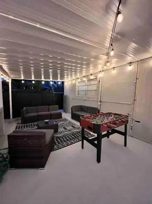 a living room with a ping pong table and a couch at Miami Luxury Home! Next to Miami airport and beach in Miami