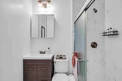 a bathroom with a toilet and a sink and a shower at Miami Cozy Home! Next to Miami beach & Airport in Miami