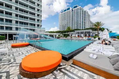 a large swimming pool in a city with buildings at High Floor Luxury 2BR 2BA, Sleeps 6, Resort Access - Horizon by HomeStakes Stays in Fort Lauderdale