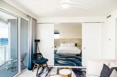 a bedroom with a bed and a view of the ocean at High Floor Luxury 2BR 2BA, Sleeps 6, Resort Access - Horizon by HomeStakes Stays in Fort Lauderdale