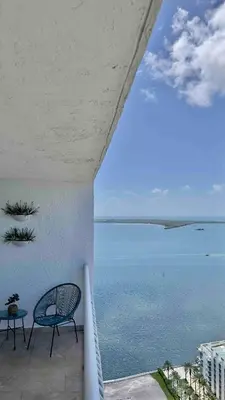 a view of the ocean from a balcony at Brickell Center w/City & Bay View + FREE Parking! in Miami