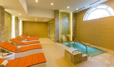 a bathroom with four beds and a tub at Gorgeous Partial Ocean View I The Ritz Carlton in Miami