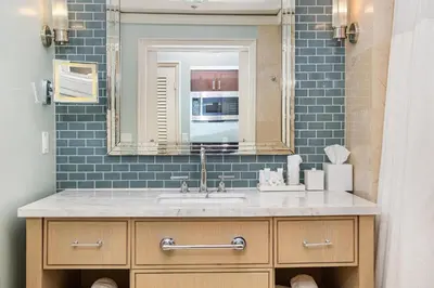 a bathroom with a sink and a mirror at Gorgeous Partial Ocean View I The Ritz Carlton in Miami