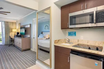 a hotel room with a kitchen and a bedroom at Gorgeous Partial Ocean View I The Ritz Carlton in Miami