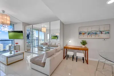 a living room with a couch and a table at Gorgeous Bay & City view condo in Brickell with Free SPA in Miami