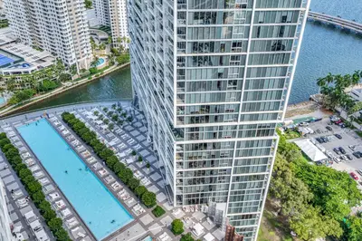 an aerial view of a tall building with a pool at Gorgeous Bay & City view condo in Brickell with Free SPA in Miami