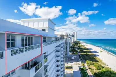 a view of the beach from the balcony of a building at OceanFront Luxury Penthouse 2 Bedrooms with Direct Ocean View in Miami Beach