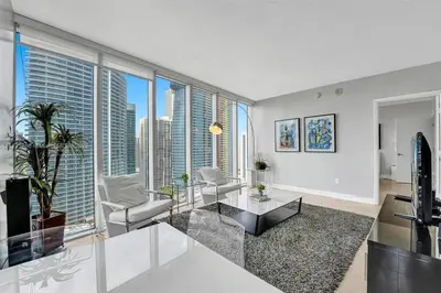 a living room with a view of a city at Waterfront Luxury Apartment 2 Bedrooms IconBrickell in Miami
