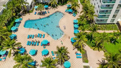 an aerial view of a pool at a resort at Tides Ocean Retreat by Cielo Stays in Hollywood