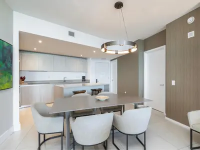 a kitchen and dining room with a table and chairs at Luxury Ocean Escape by Cielo Stays in Hollywood