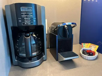 a coffeemaker next to a coffee maker on a counter at Beachfront-Spacious W Residence in Fort Lauderdale