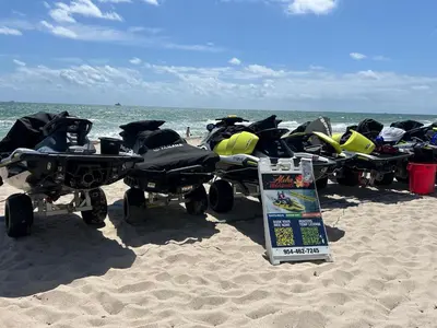 a group of four atvs parked on the beach at Beachfront-Spacious W Residence in Fort Lauderdale