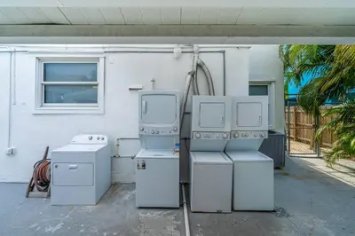 two old appliances sitting outside of a house at Lovely Studio Walking Distance To Ocean - Suite 8 in Hollywood