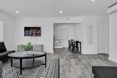 a living room with a couch and a table at Lovely 1 Bedroom Walking Distance To Ocean - Suite 9 in Hollywood