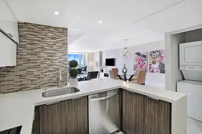 a kitchen with a sink and a counter top at Dreamscape! Renovated and spacious 1 bedroom condo in Miami