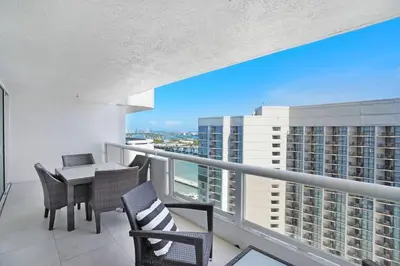 a balcony with a table and chairs on a building at Dreamscape! Renovated and spacious 1 bedroom condo in Miami