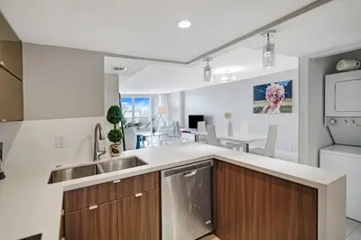 a kitchen with a sink and a counter top at Sin City! Brand new and water view! in Miami