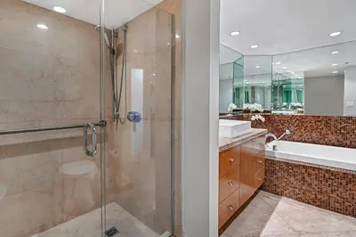 a bathroom with a shower and a sink at Only in My Dreams! Direct Water View Luxury Condo in Miami