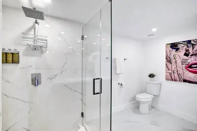 a bathroom with a shower and a toilet at Feels Like Summer ~ Panoramic Water Views! in Miami