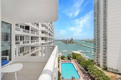 a view of a river from the balcony of a building at Sun-Kissed & Sunshine! Direct Water and City Views in Miami