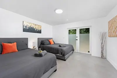 a bedroom with two beds and a window at Beautiful Villa with heated pool Must seen! in Miami