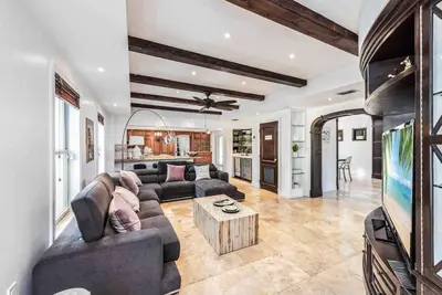 a living room with a couch and a tv at Villa sleeps 18 in Miami Shores with Movie theater / Pool / Jacuzzi in Miami