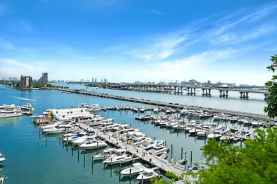 a bunch of boats are docked in a harbor at The Queen B! Water & Skyline Views - Renovated in Miami