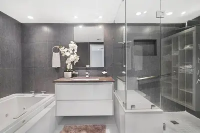 a bathroom with a tub and a sink and a shower at Seas The Day! Complete Panoramic Water Views in Miami
