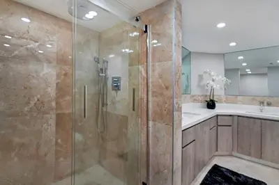 a bathroom with a shower and a sink at First Class! - Crystal clear water views! in Miami
