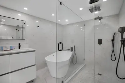 a bathroom with a shower and a sink and a tub at Make It Happen! Brand New with Amazing Water Views in Miami