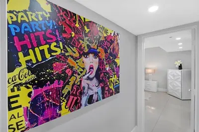 a large painting on a wall in a room at The Marilyn! Renovated and Amazing Skyline Views! in Miami