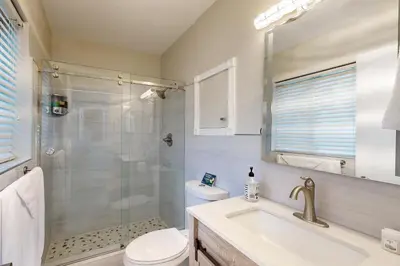 a bathroom with a shower and a toilet and a sink at Sunny Oasis in Hollywood