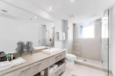 a bathroom with a sink and a toilet and a shower at HydeHotel 2BED Lux Condo Ocean View Resort in Hollywood
